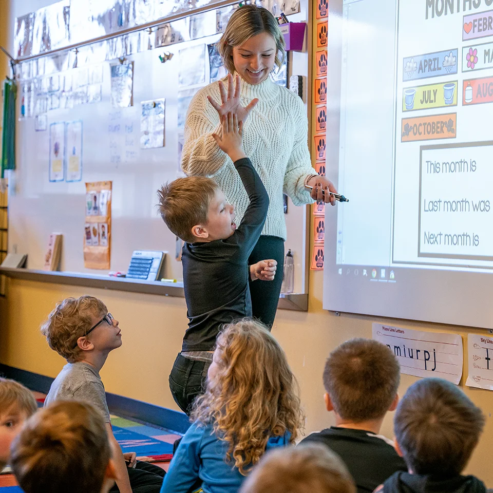 BW student teacher in classroom with young children